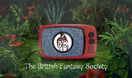 image showing a small red old-fashioned portable TV showing the BFS logo on top of static on the screen, sitting in a garden with red flowers, ferns and grass