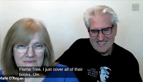 Photograph of a smiling Marie O'Regan on the left, and Paul Kane on the right.