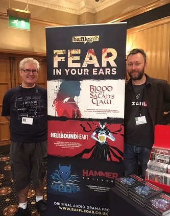 Paul Kane and Simon Barnard of Bafflegab Productions with Bafflegab banner featuring Paul's adaptation of Clive Barker's The Hellbound Heart