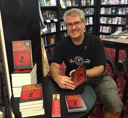 Paul Kane signing copies of Sherlock Holmes and the Servants of Hell