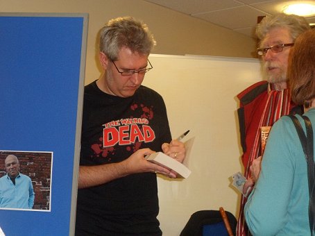 Paul Kane signing copies of Mammoth Bookd of Body Horror