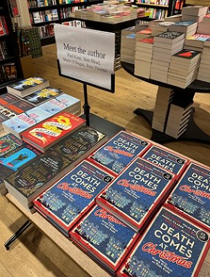 photograph of a shop display featuring copies of Death Comes at Christmas, edited by Marie O'Regan and Paul Kane