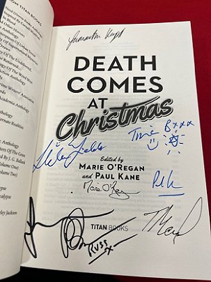 photograph of the title page of a signed Death Comes at Christmas, edited by Marie O'Regan and Paul Kane. Signed by: Samantha Hayes, Tina Baker, Fiona Cummins, Helen Fields, Russ Thomas, Tom Mead, Marie O'Regan and Paul Kane