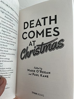 photograph showing title page of Death Comes at Christmas, edited by Marie O'Regan and Paul Kane