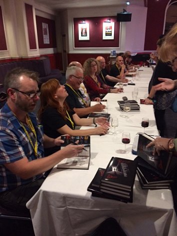 Author signing for Ten Tall Tales