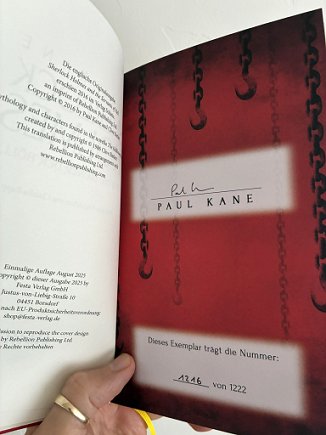 photograph showing the signing sheet on the inside of the German edition of Sherlock Holmes and the Servants of Hell by Paul Kane