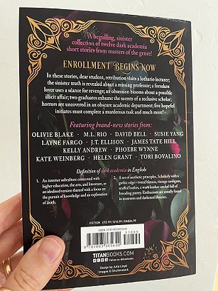 photograph showing the back cover of the paperback version of In These Hallowed Halls, edited by Marie O'Regan and Paul Kane