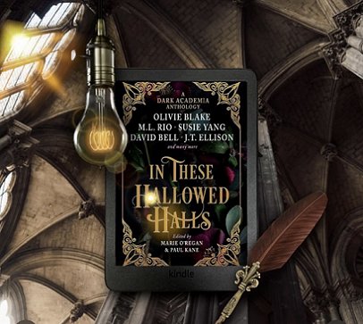 A Kindle showing the cover of In These Hallowed Halls, edited by Marie O'Regan and Paul Kane, against a vaulted ceiling background, with a glowing lightbulb and a quill pen alongside