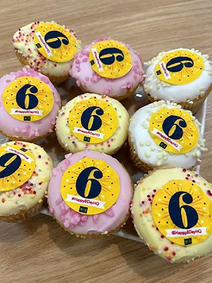 Image of cupcakes decorated with the number six and Happy BDay HQ