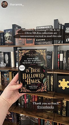 Image of a woman's hand holding a copy of In These Hallowed Halls, edited by Marie O'Regan and Paul Kane, up against a background of full bookshelves