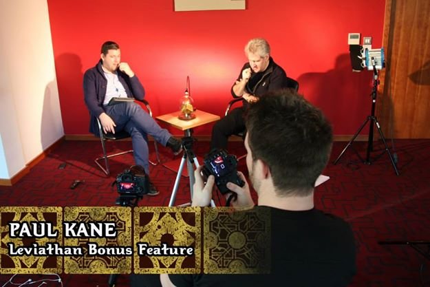 photograph of Paul Kane (R) being interviewed by Leviathan producer Gary Smart. Text reads: Paul Kane - Leviathan Bonus Feature 
