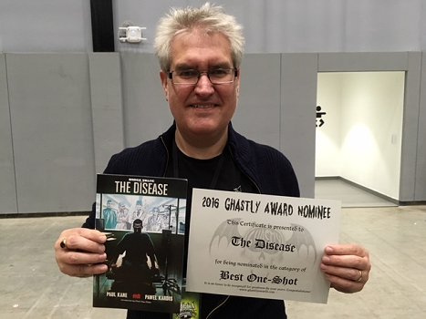 Paul Kane with award certificate and a copy of his graphic novel, The Disease