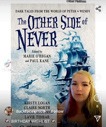 screenshot of TikTok image featuring a woman standing in front of a copy of The Other Side of Never, edited by Marie O'Regan and Paul Kane