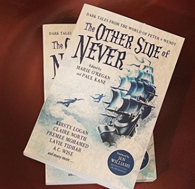 Two copies of The Other Side of Never, edited by Marie O'Regan and Paul Kane