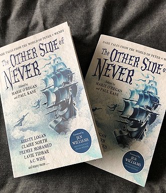 Two copies of The Other Side of Never, edited by Marie O'Regan and Paul Kane
