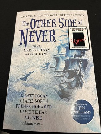 A signed copy of The Other Side of Never, edited by Marie O'Regan and Paul Kane