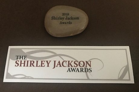 Shirley Jackson Awards bookmark and 2019 Shirley Jackson Awards nominee token pebble