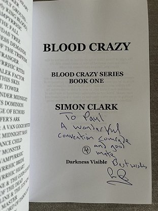 Photograph of signed title page of Blood Crazy by Simon Clark. Message reads To Paul A wonderful convention comrade and good mate. Best wishes, Simon Clark