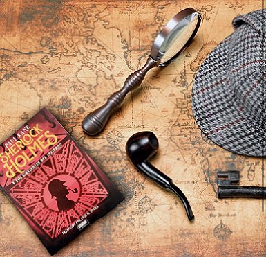 image showing a copy of SHerlock HOlmes y los sirvientes del infierno, by Paul Kane, on top of an antique world map, alongside a pipe, a magnifying glass, a key and a deerstalker hat