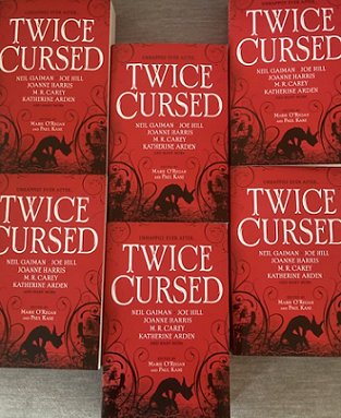 Book display - six copies of Twice Cursed, edited by Marie O'Regan and Paul Kane