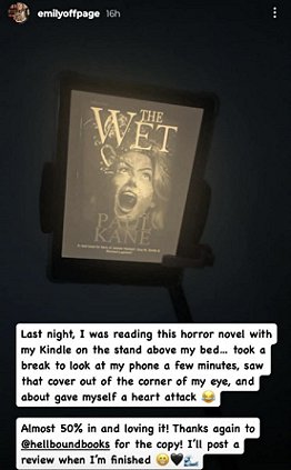 screenshot from @emilyoffpage. Image shows a Kindle screen featuring The Wet by Paul Kane. Text reads: Last night, I was reading this horror novel with my Kindle on the stand above my bed... took a break to look at my phone a fwe minutes, saw that cover out of the corner of my eye, and about gave myself a heart attack.