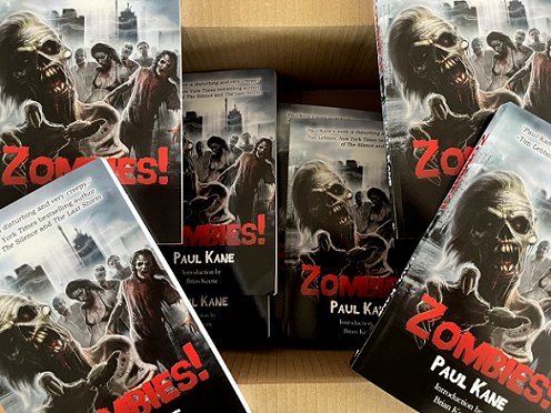 Picture of copies of the book Zombies! by Paul Kane in an open cardboard box